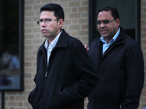 Kuldeep Singh Dharni, left, leaves Superior Court with an unidentified man, Monday, Oct. 14, 2012.  Dharni was acquitted Friday of all charges. (DAX MELMER/The Windsor Star)