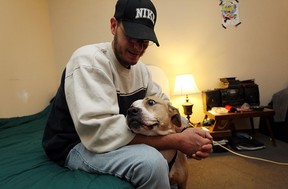 James Bush is seen with his dog Kado at the Fort Malden Motel in Amherstburg on Friday, October 19, 2012. Bush is having a hard time finding an apartment after being forced to leave his last one due to a fire.               (TYLER BROWNBRIDGE / The Windsor Star)