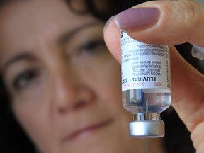 Pharmacist Christine Ziter prepares to administer a flu shot at the Windsor pharmacy on Oct. 18, 2012.  (DAN JANISSE/ The Windsor Star)
