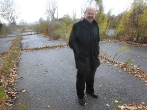 Marty Gervais stands on the ghost road used as a drag strip in the ’60s. Tuesday he launches his new book, Ghost Road and Other Forgotten Stories of Windsor. (DAN JANISSE / The Windsor Star)