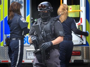 Windsor Police ESU officer at the scene of a gun call in the 3400 block of Peter Street in Windsor, Ontario, Friday, Oct. 19, 2012. (DAN JANISSE/The Windsor Star