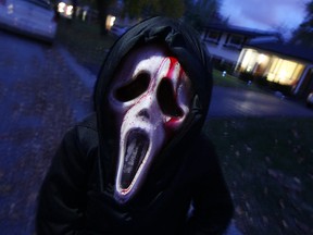 Trick-or-treater Dale Lacombe runs amok on Halloween night in Windsor, Ont. in this 2010 file photo. (Tyler Brownbridge / The Windsor Star)