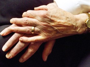 File photo of seniors holding hands. (Postmedia News files)