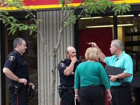 Windsor police investigate a bank robbery on Ottawa Street at Moy Avenue in Windsor, Ont.,  Thursday, June 21, 2012. (The Windsor Star / KRISTIE PEARCE)