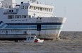 A volunteer auxillary vessel, the Colchester Guardian, passes the Jiimaan after the Pelee Island ferry ran aground in Lake Erie near Kingsville, Ontario on October 11, 2012.  (JASON KRYK/ The Windsor Star)