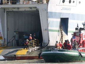 The M.V. Jiimaan sits on a sandbar Friday, Oct. 12, 2012, near the Kingsville Harbour in Kingsville, Ont. The ferry ran aground Thursday while approaching the dock with 34 people aboard. (DAN JANISSE/ The Windsor Star)