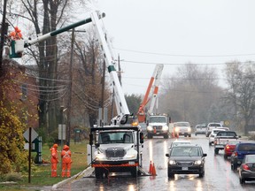 Hydro One  crews were kept busy along Seacliff Drive in Kingsville, Ontario as high winds continue cause power outages in southwestern Ontario.  The large weather system spawned by hurricane Sandy continues to move north and east.  (JASON KRYK/ The Windsor Star)