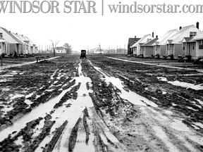 JAN.13/1950- View of Labadie Rd. with a lone delivery wagon in the distance. Water and mud have made this and many other streets impassable fro trucks and cars. (The Windsor Star-FILE)