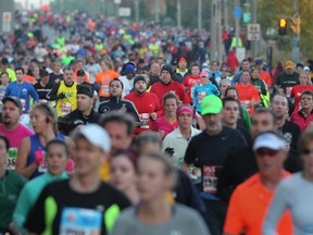 Participants in the 35th annual Detroit Free Press Marathon run east down Riverside Drive in Windsor, Ont., Sunday, Oct. 21, 2012.  (DAX MELMER/The Windsor Star)