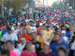 Participants in the 35th annual Detroit Free Press Marathon run east down Riverside Drive in Windsor, Ont., Sunday, Oct. 21, 2012.  (DAX MELMER/The Windsor Star)