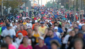 Participants in the 35th annual Detroit Free Press Marathon run east down Riverside Drive in Windsor, Ont., Sunday, Oct. 21, 2012.  (DAX MELMER/The Windsor Star)