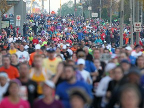 Somewhere in this mass of competitors running the recent Detroit marathon is Star reporter Kelly Steele. How did she recuperate following the 26.2-mile body slammer?  She headed to her couch for a date with reality TV. (DAX MELMER / The Windsor Star)