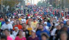 Somewhere in this mass of competitors running the recent Detroit marathon is Star reporter Kelly Steele. How did she recuperate following the 26.2-mile body slammer?  She headed to her couch for a date with reality TV. (DAX MELMER / The Windsor Star)