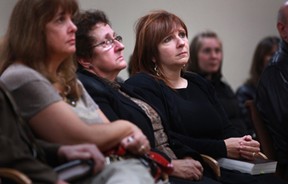 Lina Ventura, right, is surrounded by friends and family at a memorial for her late husband, James Kaput, at the Kingdom Hall of Jehovah's Witness in Amherstburg, Ont., Saturday, Oct. 20, 2012.  (DAX MELMER/The Windsor Star)