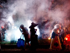 Children 'trick or treat' at a home with scary decorations on Humberside Avenue on Hallowe'en in Toronto, Ontario, Monday, October 31, 2011.  (Tyler Anderson/National Post)