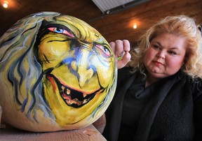 Susan Dupont Baptista paints a pumpkin for the Halloween season. Her creations are for sale at Maria's Market in Kingsville. (DAN JANISSE / The Windsor Star)