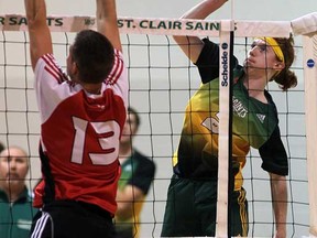 St. Clair's Connor West, right, tips the ball against Fanshawe's Seth Shuster in OCAA volleyball action from St. Clair October 30, 2012.  (NICK BRANCACCIO/The Windsor Star)