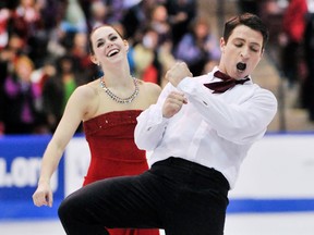Canadian ice dancer Tessa Virtue and Scott Moir celebrate their gold medal performance in the Ice Dance Free Dance,  October 30, 2011, at the 2011 Skate Canada International competition in Mississauga,(Aaron Lynett / National Post)