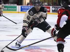 Windsor's Josh Ho-Sang, left, makes a move on Niagara's Luke Mercer at the WFCU Centre Sunday, Oct. 14, 2012. (DAX MELMER/The Windsor Star)