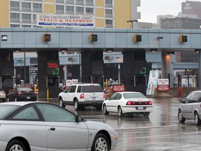 Motorists line up to pay the toll on the Canadian side of the Detroit-Windsor Tunnel in this October 2011 file photo. (Jason Kryk / The Windsor Star)