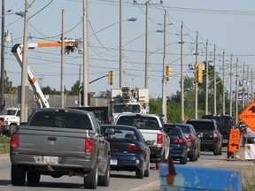 A string of cars file through the intersection of Cabana and Provincial Roads in this 2012 file photo. (DAN JANISSE/The Windsor Star)