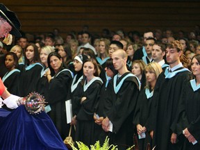 File photo: Dr. Larry Glassford, left, places the mace in front of 600 graduating Faculty of Education students during the University of Windsor's 91st Convocation held at St. Denis Centre, Wednesday June 17, 2009.