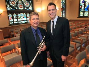 Guest conductor Eric Paetkau, right, and trumpeter Ross Turner pose before the start of Friday's Windsor Symphony Orchestra chamber concert at the Assumption Chapel in Windsor. (DAN JANISSE / The Windsor Star)