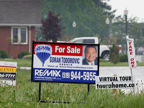 For sales signs line a street in Windsor in this file photo. (TYLER BROWNBRIDGE/The Windsor Star)