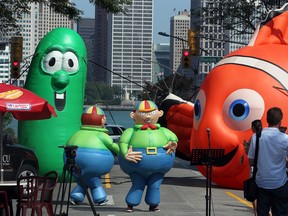 Balloonapalooza inflatables Tweedledee and Tweedledum dance on the street on Ouellette Avenue between Pitt Street and Riverside Drive last August. (NICK BRANCACCIO/The Windsor Star)