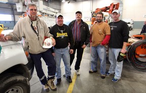 Enwin Utilities Ltd. workers Duane Matthews, left, Morgan Wortley, Peter Gietz, Greg Costea and Pete Harrison, right, prepare for their trip to Long Island, New York November 5, 2012.  Joining the group is Val Ward, not shown. (NICK BRANCACCIO/The Windsor Star)