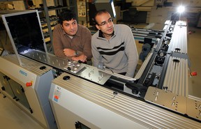 Dr. Tarek Al Geddawy, left, and Dr. Sameh Badrous examine a portion of the state-of-the-art iFactory system at the engineering faculty at the University of Windsor Friday, November 9, 2012.  The system, one of very few in the world,  is a type of "learning factory" for engineering students.  (NICK BRANCACCIO/The Windsor Star)