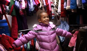 Marissa Spooner, 7, tries on a winter jacket to show her mother, Barb Spooner, at the 28th annual Coats for Kids campaign at the Unemployed Help Centre, Saturday, Nov. 3, 2012.  (DAX MELMER/The Windsor Star)