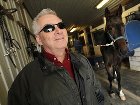 Owner Stu McIntosh takes a break at the Classic Farms Stables in Windsor.  (TYLER BROWNBRIDGE/The Windsor Star)