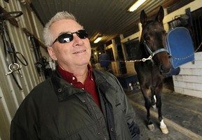 Owner Stu McIntosh takes a break at the Classic Farms Stables in Windsor.  (TYLER BROWNBRIDGE/The Windsor Star)
