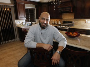 Tarik Balbaki sits in the kitchen of his new home on Askin Avenue in South Windsor. Balbaki's neighbourhood was the second fastest growing area in the region from 2006 to 2011. (NICK BRANCACCIO/The Windsor Star)