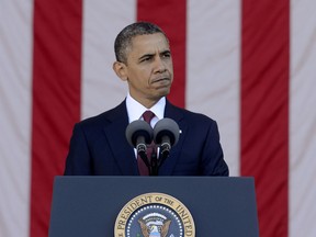 President Barack Obama spaeks after a wreath-laying ceremony on Veteran's Day at the Tomb of the Unknown Soldier in Arlington National Cemetery on November 11, 2012 in Arlington, Virginia. (Photo by Michael Reynolds-Pool/Getty Images)