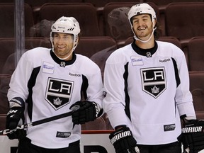 Amherstburg's Kevin Westgarth, right, and Jarret  Stoll of the Kings take a break at practice. (Mark van Manen/PNG staff)