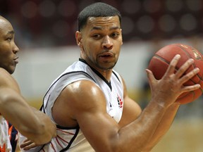 Windsor's Anthony Johnson, right, makes a move against Summerside's Antonio Ballaard in National Basketball League of Canada action at the WFCU Centre. (NICK BRANCACCIO/The Windsor Star)