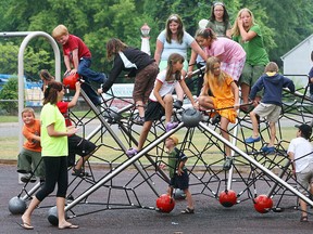 A group of children play on the jungle gym equipment at LaSalle's Front Rd.Park on July 17, 2007. (Windsor Star files)