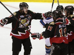 Owen Sound's Cameron Brace, right, celebrates a goal at the 2011 Memorial Cup in Mississauga. Brace scored the only goal in Sunday's 1-0 win over Windsor.  (Brett Gundlock/National Post)