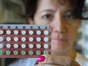 Pharmacist Christine Ziter displays birth control pills Wednesday, Nov. 21, 2012, at her Windsor, Ont. pharmacy. There is a push on to change regulations regarding over-the-counter availability of the pills.   (DAN JANISSE/ The Windsor Star)