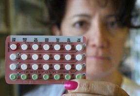 Pharmacist Christine Ziter displays birth control pills Wednesday, Nov. 21, 2012, at her Windsor, Ont. pharmacy. There is a push on to change regulations regarding over-the-counter availability of the pills.   (DAN JANISSE/ The Windsor Star)