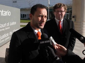 Sabhi (Alex) Bakir, left, and his lawyer John Liddle talk with reporters after the Crown withdrew all criminal charges against him. Bakir was the second fraud suspect charged after a months-long joint forces fraud probe into two Windsor car dealerships.  Bakir spoke with the media outside the Ontario Court of Justice on November 28, 2012 in Windsor, Ont.   (JASON KRYK/ The Windsor Star)