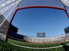 n this Feb. 9, 2012, file photo, a view from inside a hockey net shows Michigan Stadium in Ann Arbor, Mich., after the announcement of the NHL Winter Classic hockey game.  (Paul Sancya/AP)