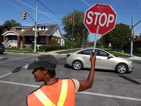 In this file photo, crossing guard Christine Handsor is shown at Campbell Avenue and Grove Avenue in Windsor, Ont., Wednesday September 12, 2012. (NICK BRANCACCIO/The Windsor Star)