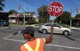 In this file photo, crossing guard Christine Handsor is shown at Campbell Avenue and Grove Avenue in Windsor, Ont., Wednesday September 12, 2012. (NICK BRANCACCIO/The Windsor Star)