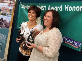 Deb Bezaire and Heather Brown (right) accept their Daisy Awards during a brief ceremony at the Windsor Regional Hospital in WIndsor on Tuesday, November 20, 2012. The bi-annual Daisy awards are handed out to nurses who display unique care to their patients. The awards were established by the the family of Patrick Barnes who died at the age of 33 from Idiopathic Thrombocytopenia Purpura.   (TYLER BROWNBRIDGE / The Windsor Star)