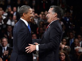 Barack Obama and Mitt Romney are seen in this file photo. (AP Photo/Michael Reynolds)
