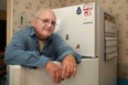 Herb Bechtel, 77, stands next to his refrigerator that he received from Enwin Utilities in an energy saving program, Saturday, Nov. 3 , 2012.  (DAX MELMER/The Windsor Star)