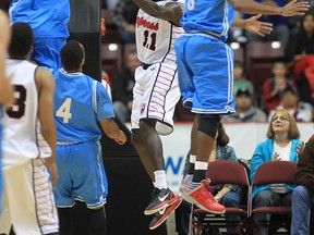 Windsor Express player Isaac Kuon (C) drives to the basket Friday, Nov. 2, 2012, during their game at the WFCU Centre in Windsor, Ont. against the Halifax Raimen    (DAN JANISSE/The Windsor Star)
